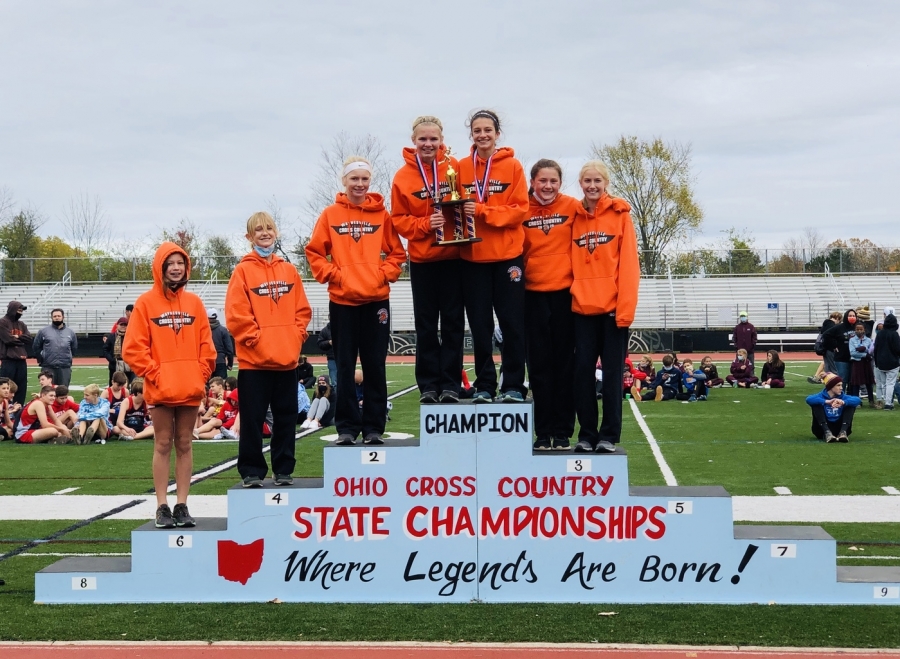 girls on podium for trophy presentation